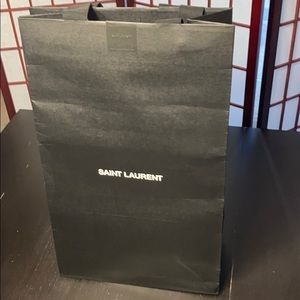 Saint Laurent tall black gift bag.
